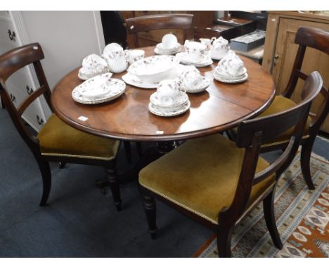 A 19TH CENTURY MAHOGANY BREAKFAST TABLE with circular top on tripod base, 43" dia and four 19th century mahogany bar-back din