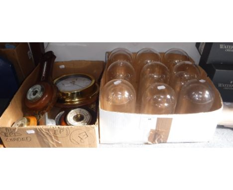A BRASS CASED BAROMETER, a collection of barometers and a quantity of clock domes