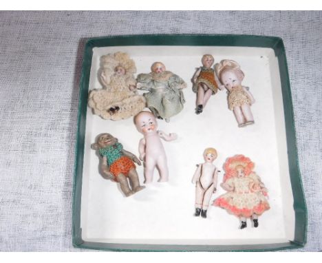 A COLLECTION OF 19TH CENTURY (and later) BISQUE CERAMIC ARTICULATED BABY DOLL FIGURES and a similar monkey