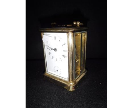 A FRENCH BRASS-CASED CARRIAGE CLOCK, with white enamel dial
