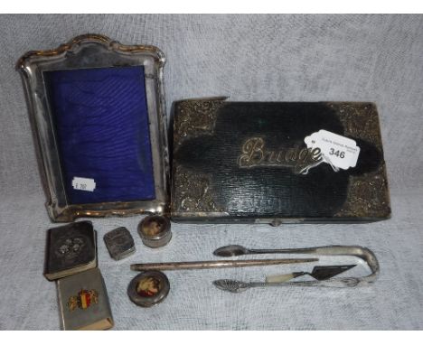 A SILVER MOUNTED PLAYING CARD BOX, a silver photograph frame and a further quantity of small silver