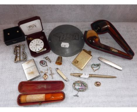 A COLLECTION OF ASSORTED ITEMS including a BSA engine cover, lighters, pipes and other items
