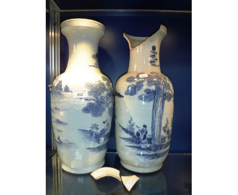 A PAIR OF CHINESE BLUE AND WHITE VASES decorated with figures beneath a tree, 18'' high