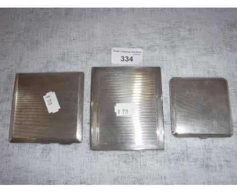 THREE SILVER CIGARETTE CASES with engine-turned decoration