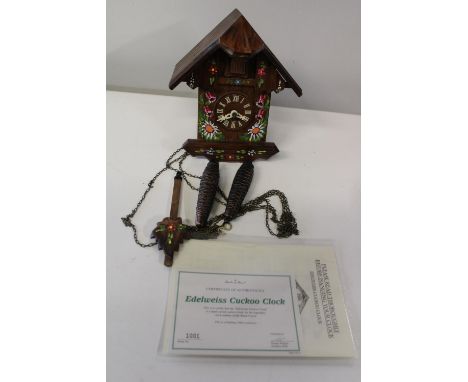 A handmade wooden Edelweiss cuckoo clock in GWO 