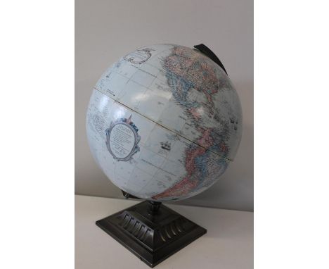 A vintage World globe on a metal stand 