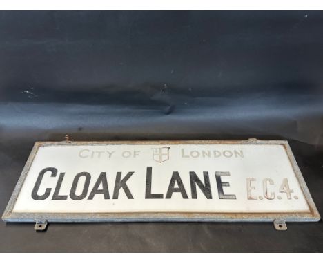 A City of London milk glass street sign in original metal frame, for Cloak Lane EC4., 36 x 24" excluding fixing lugs.
