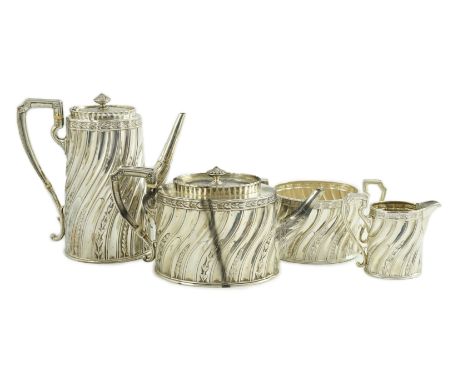 A late Victorian silver four tea and coffee service, by Walter &amp; John Barnard, of oval form with spiral fluted decoration