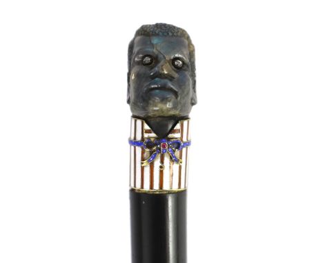A 19th century French carved labradorite, diamond, ruby and enamel handled ebonised cane, carved as a black man’s head enamel