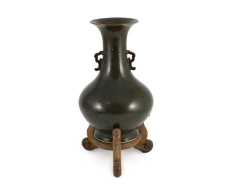 A Chinese Jian style brown glazed vase, hu, 18th/19th century, applied with a pair of shaped handles to the cylindrical neck,