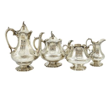 A Victorian silver pedestal four piece tea and coffee service by Robert Harper, of panelled baluster form and engraved with s