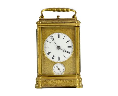 A late 19th century French engraved gilt brass gorge-cased repeating carriage clock with alarm, with scroll engraved case and