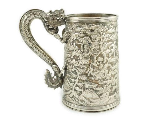 A 19th century Chinese Export double skinned silver mug, by Leeching (a.f.), with engraved inscription date 1869, dragon hand
