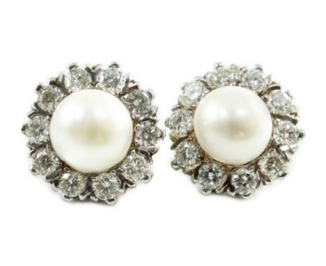 A pair of white gold? cultured pearl and diamond cluster set circular earrings, the pearls detachable, to be worn by themselv