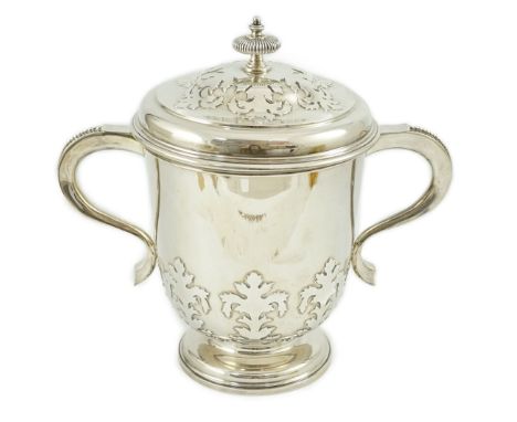 A George VI silver two handled cup and cover by William Comyns & Sons Ltd, with card cut decoration, London, 1937, 28.2cm, 60