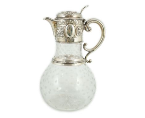 A Victorian embossed silver mounted engraved glass claret jug, the glass later, the silver, Sheffield, 1868, by William and G