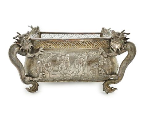 A late 19th/early 20th century Chinese Export silver planter, maker WC, of rectangular form, with four dragon handles and emb