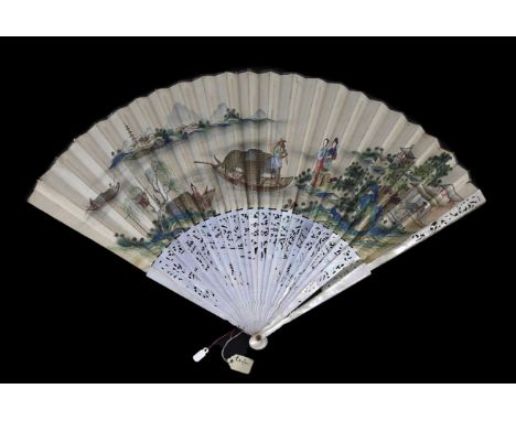 A Chinese painted leaf fan with mother-of-pearl sticks, 19th century, the leaf painted with ladies on the shoreline, a fisher
