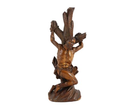 An 18th century German boxwood figure of St Sebastian bound to a tree trunk, height 22cm***CONDITION REPORT***Fingertips to h