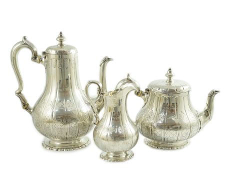 A Victorian silver three piece coffee set, comprising pot, cream and sugar bowl, by Walter Morrisse, of pear form, with engra