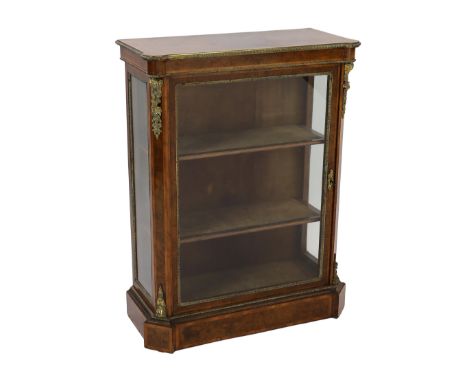 A 19th century French ormolu mounted figured walnut pier cabinet, with single glazed door and plinth foot, width 90cm depth 4