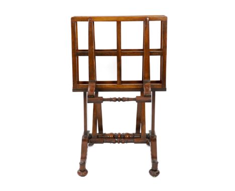 An early Victorian rosewood folio stand, with ratcheting mechanism adjusting to seven different positions, turned stretches a