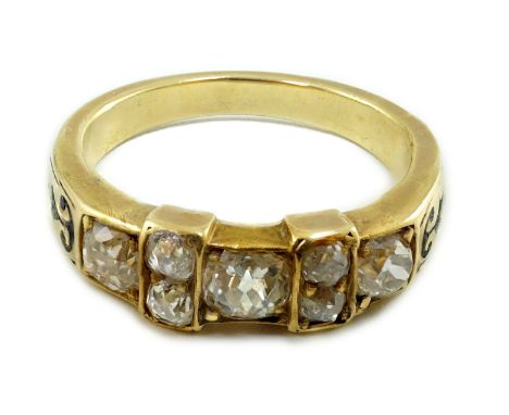 A late 19th century gold and seven stone old mine cut diamond and black enamelled cluster half hoop ring, size M, gross weigh