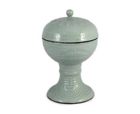 A Chinese white glazed vessel and cover, dou, Qing or later, moulded with archaistic scrolls, 25cm high***CONDITION REPORT***