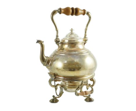 A large George V Britannia standard silver tea kettle on two handled stand, with burner, by Charles &amp; Richard Comyns, of 