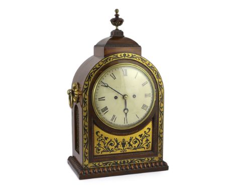 Davies &amp; Napper. A Regency cut brass inlaid rosewood bracket clock, of arched architectural form, with urn finial and bra