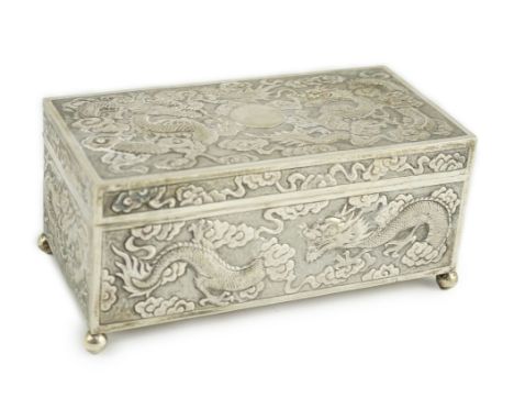 A late 19th/early 20th century Chinese Export silver rectangular cigarette box, by Wang Hing?, embossed with dragons, on ball