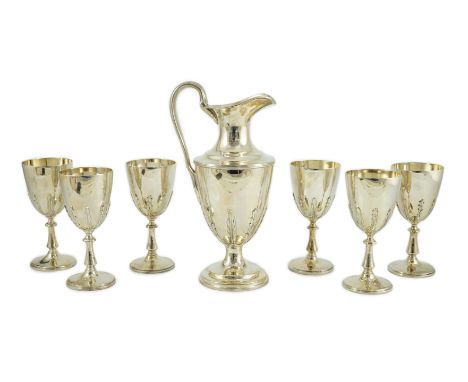A modern cased silver ewer and six matching goblets by Courtman Silver Ltd, all with leaf decoration, ewer London, 1975, gobl
