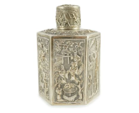 A late 19th century Chinese Export silver hexagonal tea caddy and cover, by Cumwo, embossed with various scenes, depicting fi