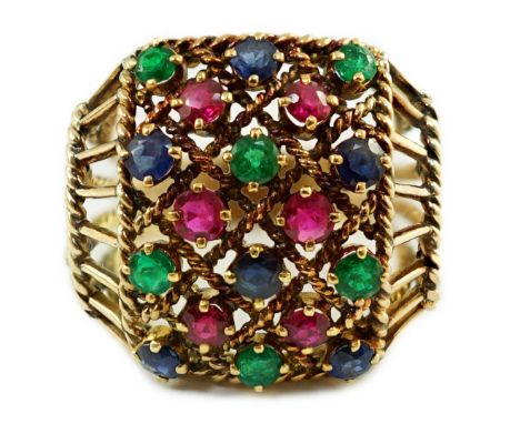 An Indian gold, ruby, sapphire and emerald cluster set dress ring, with rope twist shoulders, size N, gross weight 7.3 grams.