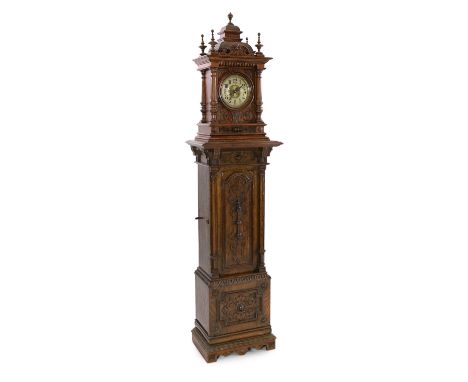 A Symphonion oak musical longcase hall clock, c.1895, playing 13.5in. discs, of architectural form with strapwork motifs thro