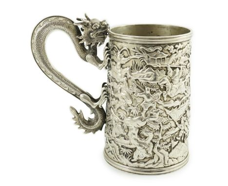 A late 19th century Chinese Export double skinned silver mug, by Leeching?, with dragon handle and embossed with continuous b