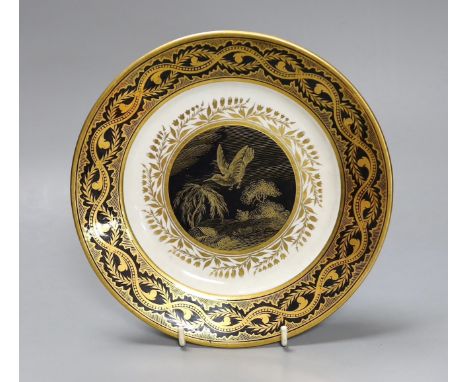 A rare Derby plate from the Pares service, c.1810, decorated in imitation of oriental lacquer with a black border richly gilt