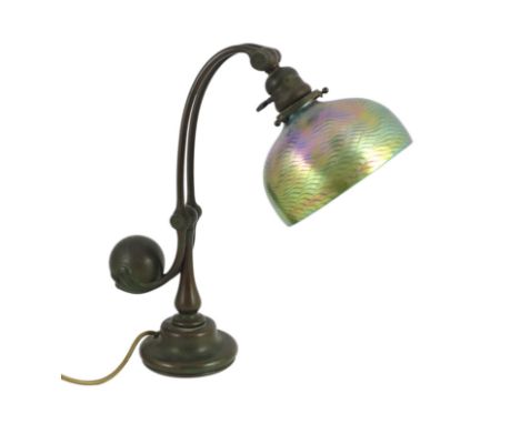 Tiffany Studios, a counter-balance patinated bronze desk lamp with ‘favrile’ glass shade, c.1905, with adjustable angle and t