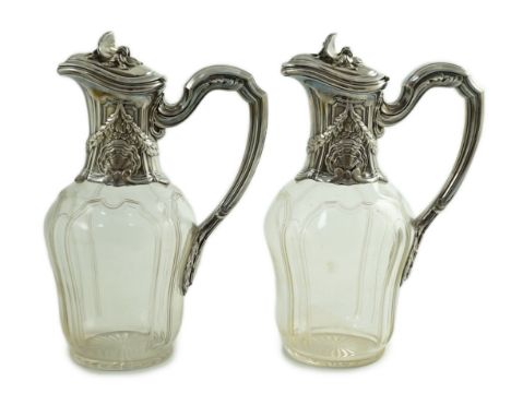 A pair of early 20th century French 950 standard silver mounted glass claret jugs, by Risler & Carre, with shell and swag dec