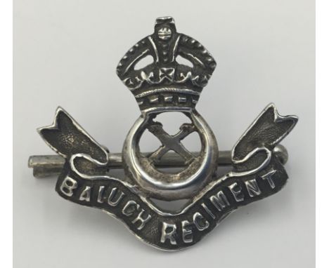 A scarce, likely Indian made officer’s cast silver headdress badge for the 10th Baluch Regiment. Featuring 2 lugs to the reve
