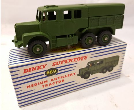 Dinky, a boxed 689 Medium Artillery Tractor. Although unchecked for completeness condition appears Good Plus to Excellent wit