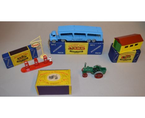 3 Matchbox Moko Lesney Accessory Packs: No. 1 Esso Petrol Pump Set; No. 2 Car Transporter; No. 3 Garage. Together with a Lesn