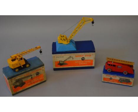 Three Dinky Toys: 571 Coles Mobile Crane; 555 Fire Engine with Extending Ladder; 752 Goods Yard Crane. Overall F-G, all with 