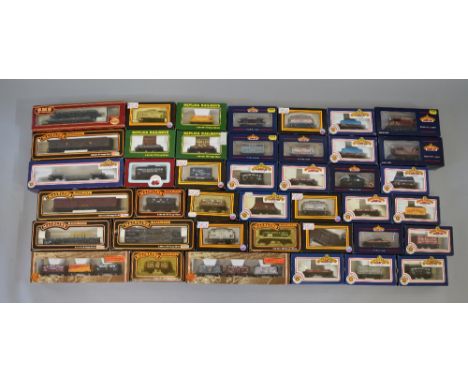 OO Gauge. 41 x boxed rolling stock. Various manufacturers. Includes 2 x Bachmann triple packs. Overall VG in G boxes.