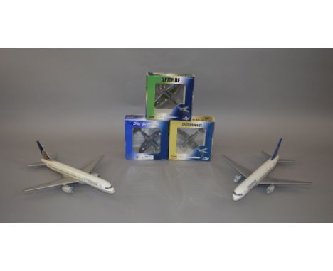 Two travel agent window style model aircraft, 1:100 scale, both 757-200 continental models, Together with three boxed 1:72 sc