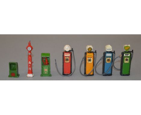 Britains petrol pumps: Shell; BP; Dominion; Benzole National Mixture; three other accessories. Overall G. (7)