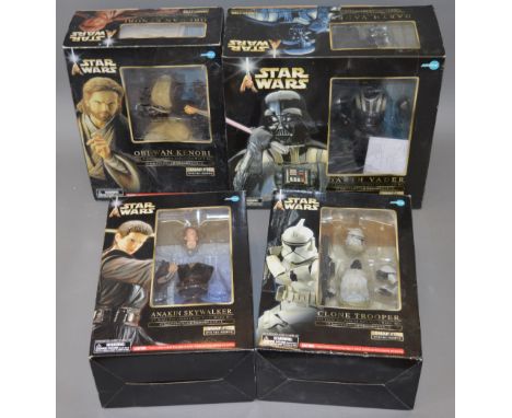 Four ArtFX Kotobukiya Snap-Fit 1:7 scale Soft Vinyl Model Kits: Obi-Wan Kenobi; Darth Vader; Clone Trooper; Anakin Skywalker.