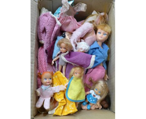 A collection of vintage dolls and clothing 