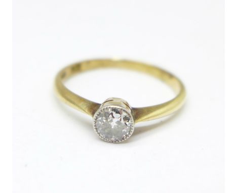 An 18ct gold and diamond solitaire ring, 1.9g, K, (chip to the diamond) 