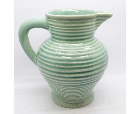 A Clarice Cliff ribbed water jug 